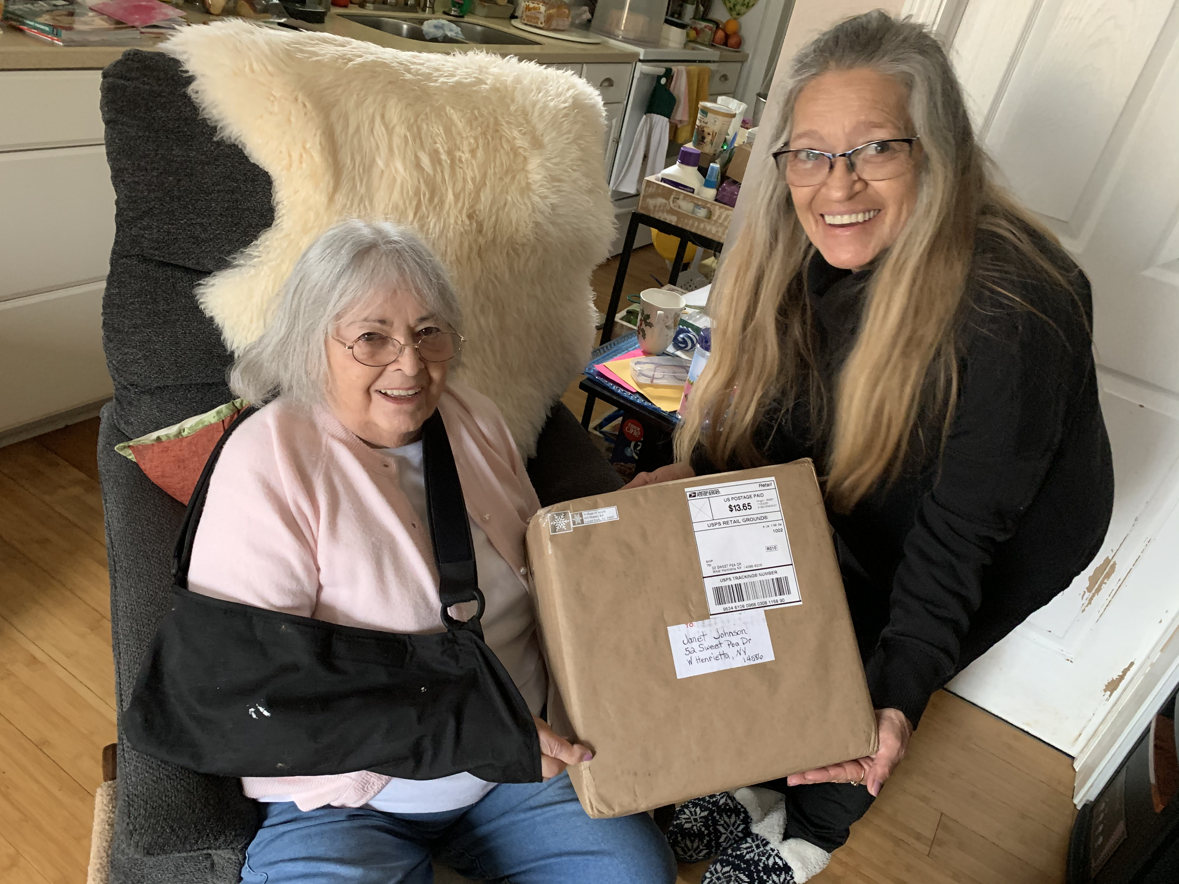 Janet and Evie with a package