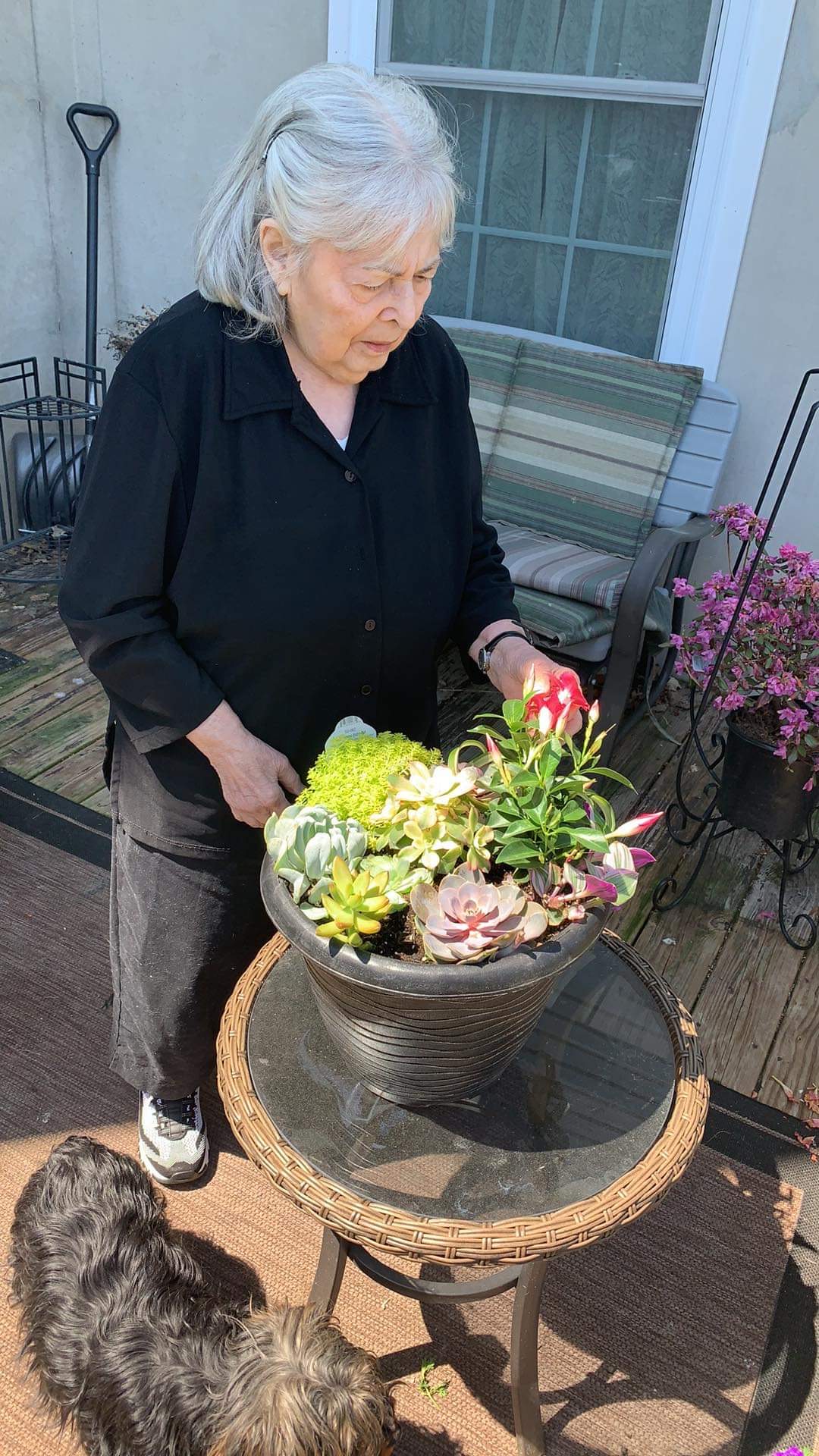 Janet taking care of her flowers